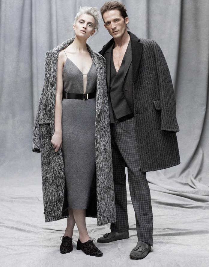 图中女士身着：保罗·史密斯（Paul Smith）羊毛大衣（1,490英镑），雨果·博斯（Hugo Boss）羊毛吊带裙（630英镑），皮腰带（150英镑），迪奥（Dior）马驹皮系带靴（690英镑）。图中男士身着：杰尼亚高级定制（Ermenegildo Zegna Couture）羊毛大衣（3,150英镑），羊毛西装（2,090英镑），羊毛长裤（790英镑），羊毛背心（960英镑），周仰杰（Jimmy Choo）山羊皮拖鞋（375英镑）。