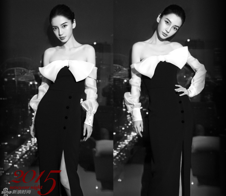 Angelababy一席黑白裸肩长裙迎接2015年的到来，妆容干净，盘发露出精致五官。2014年可谓是“angelababy的年”，综艺、电影、杂志百花齐放。